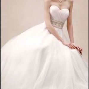 Oleg Cassini wedding dress. Had it dry cleaned. Size 12.